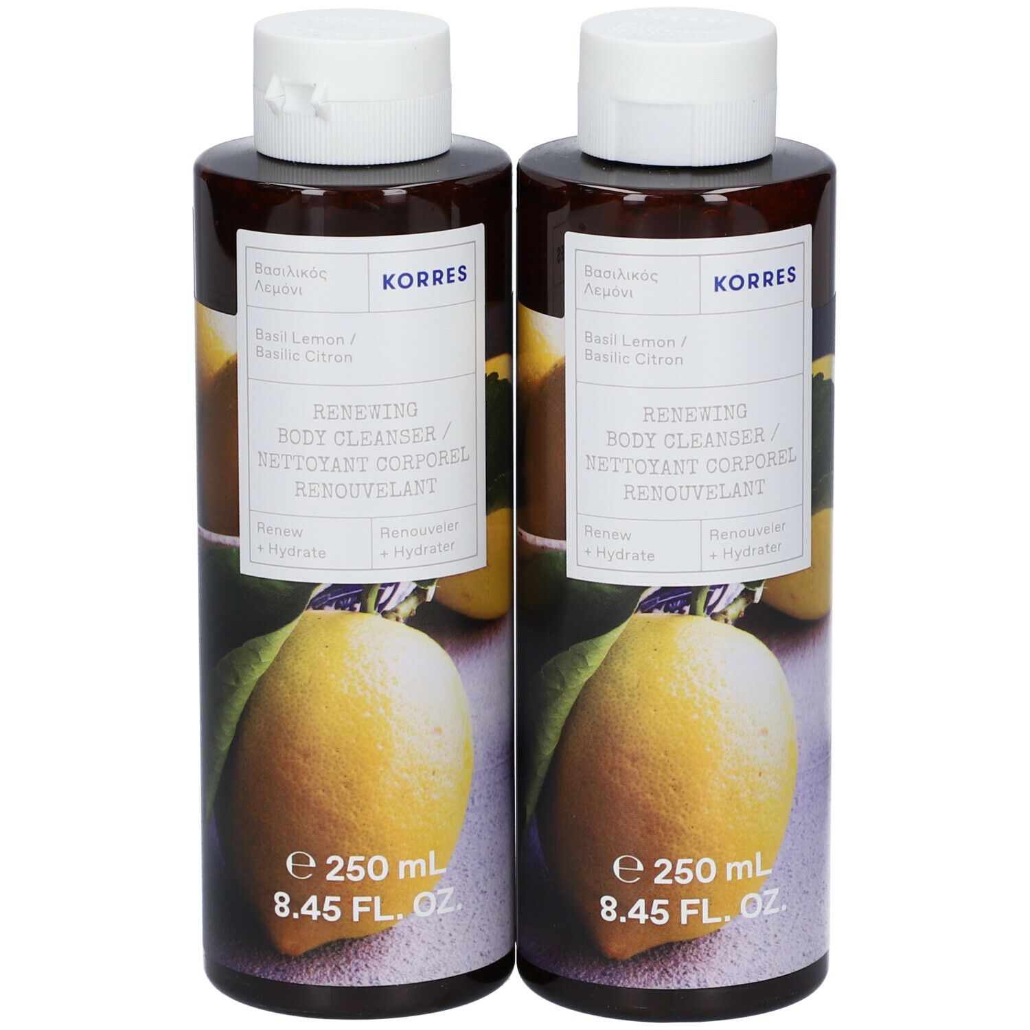 Twee flessen KORRES® Renewing Body Cleanser. Bruine flessen met witte dop en etiket. Opschrift: Basilicum & Citroen, 250 ml.