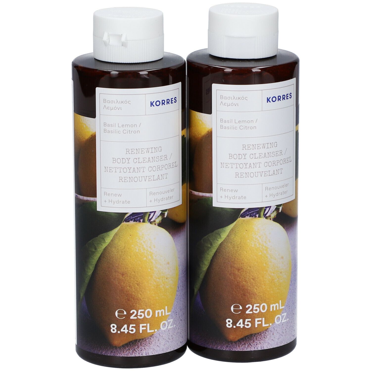 Twee flessen KORRES® Renewing Body Cleanser. Bruine flessen met witte dop en etiket. Opschrift: Basilicum & Citroen, 250 ml.