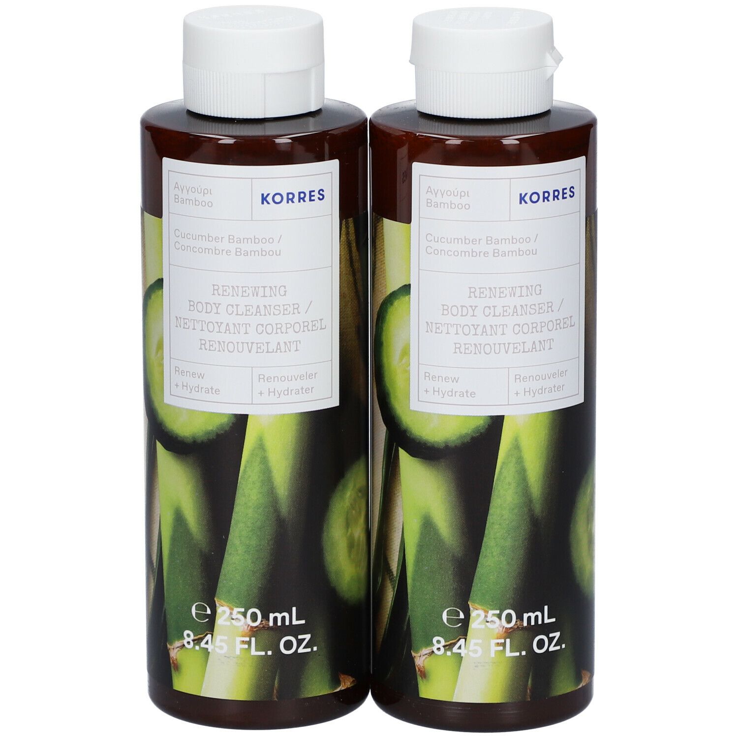 Twee flessen body cleanser met witte dop. Opschrift: KORRES, Komkommer & Bamboe, Renewing Body Cleanser.