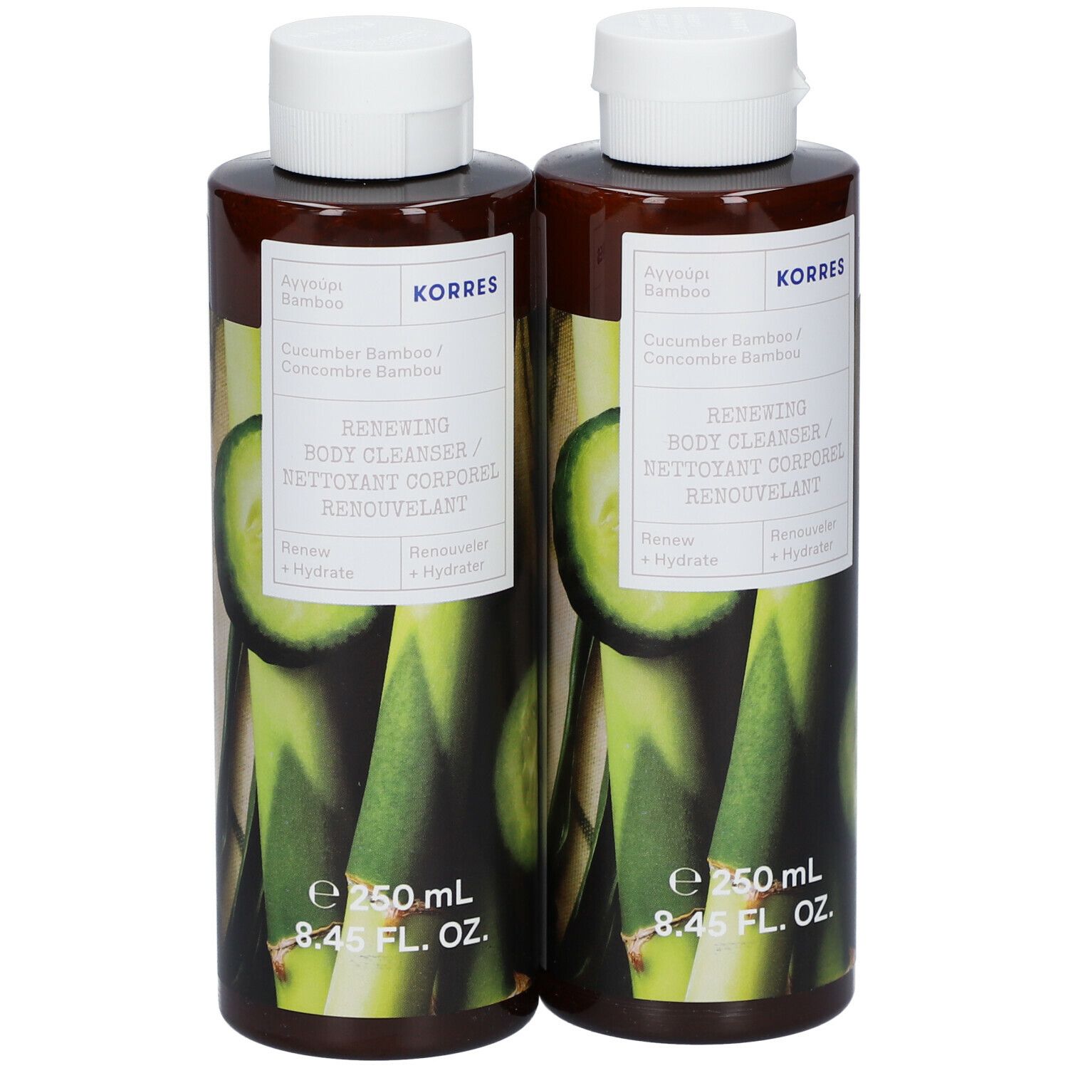 Twee flessen body cleanser met witte dop. Opschrift: KORRES, Komkommer & Bamboe, Renewing Body Cleanser.