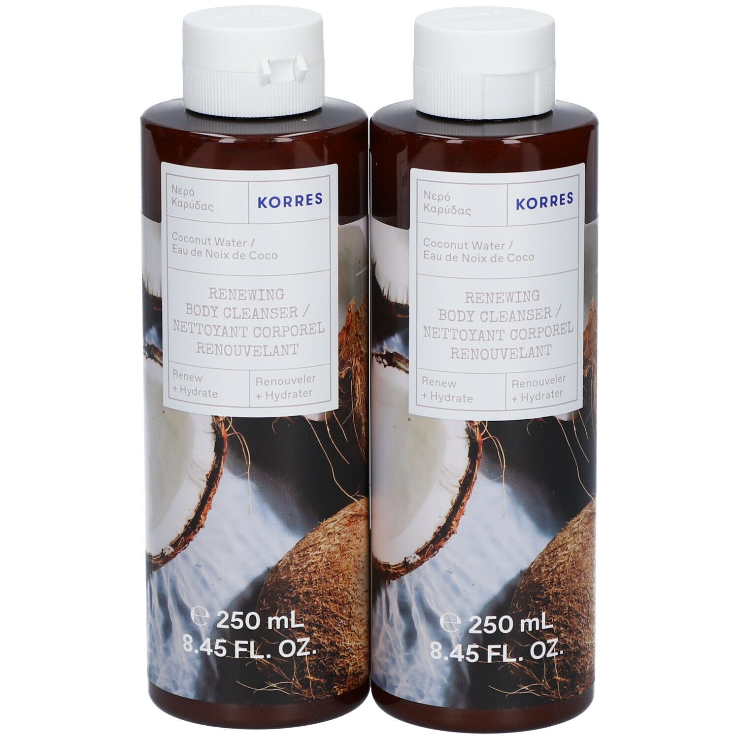 Twee flessen KORRES Renewing Body Cleanser. Bruine flessen met witte dop en etiket. Kokosnoot illustratie.