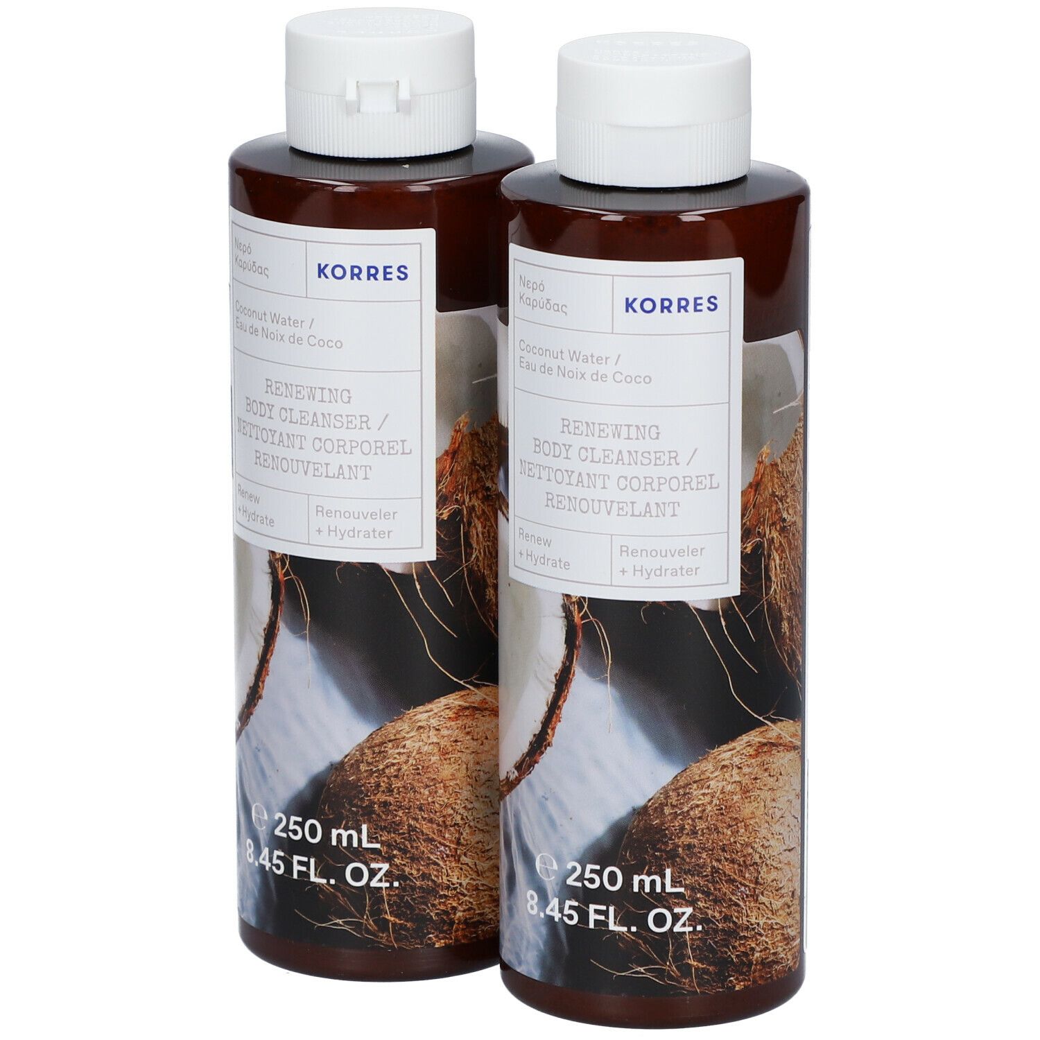 Twee flessen KORRES Renewing Body Cleanser. Bruine flessen met witte dop en etiket. Kokosnoot illustratie.