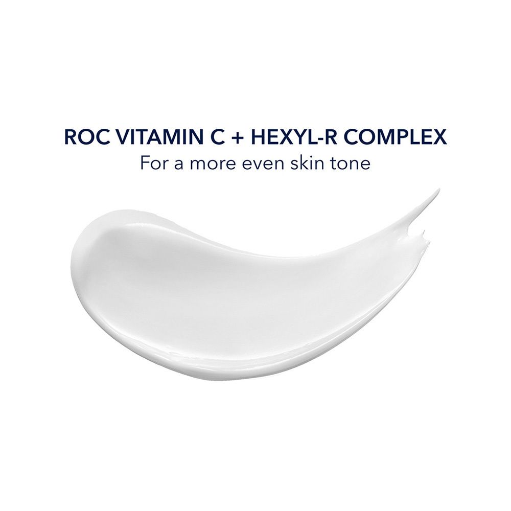 Trace de crème blanche. Texte: ROC Vitamine C + Hexyl-R Complex. Pour un teint plus uniforme.