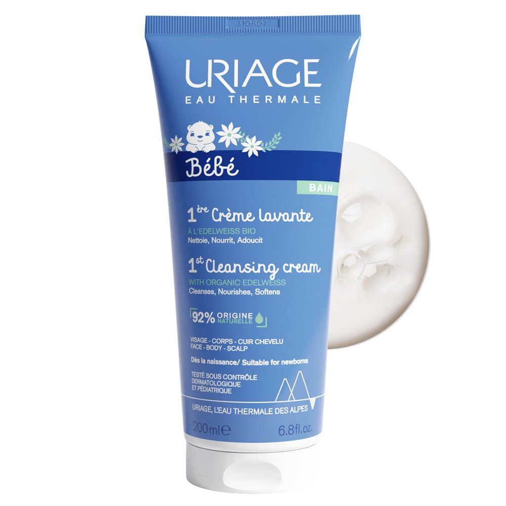 Blauwe tube Uriage Bébé 1ère Crème lavante en een kleine hoeveelheid crème ernaast.