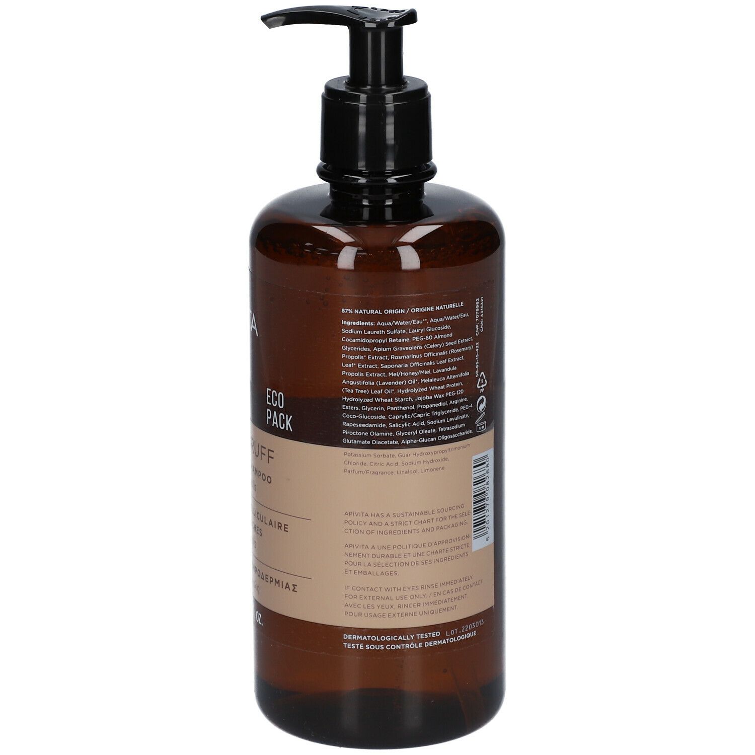 Achterkant bruine fles met tekst. Opschrift: DRY DANDRUFF Shampoo, ingrediënten, waarschuwingen.