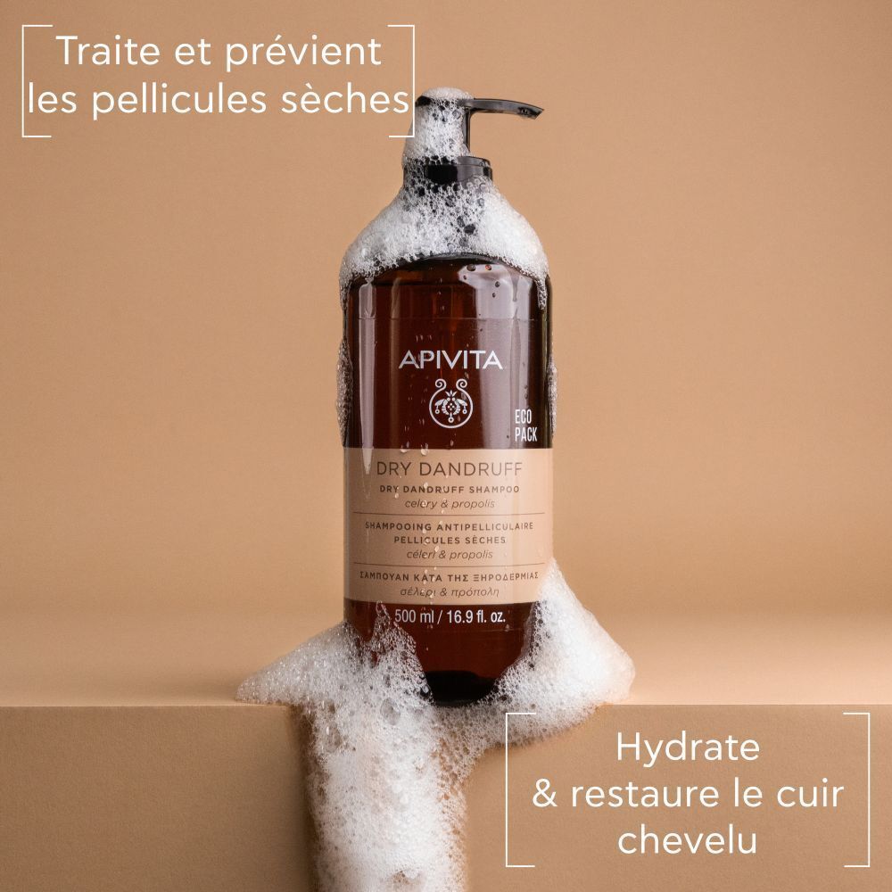 Produit avec mousse. Texte: Traite et prévient les pellicules sèches. Hydrate et restaure le cuir chevelu.