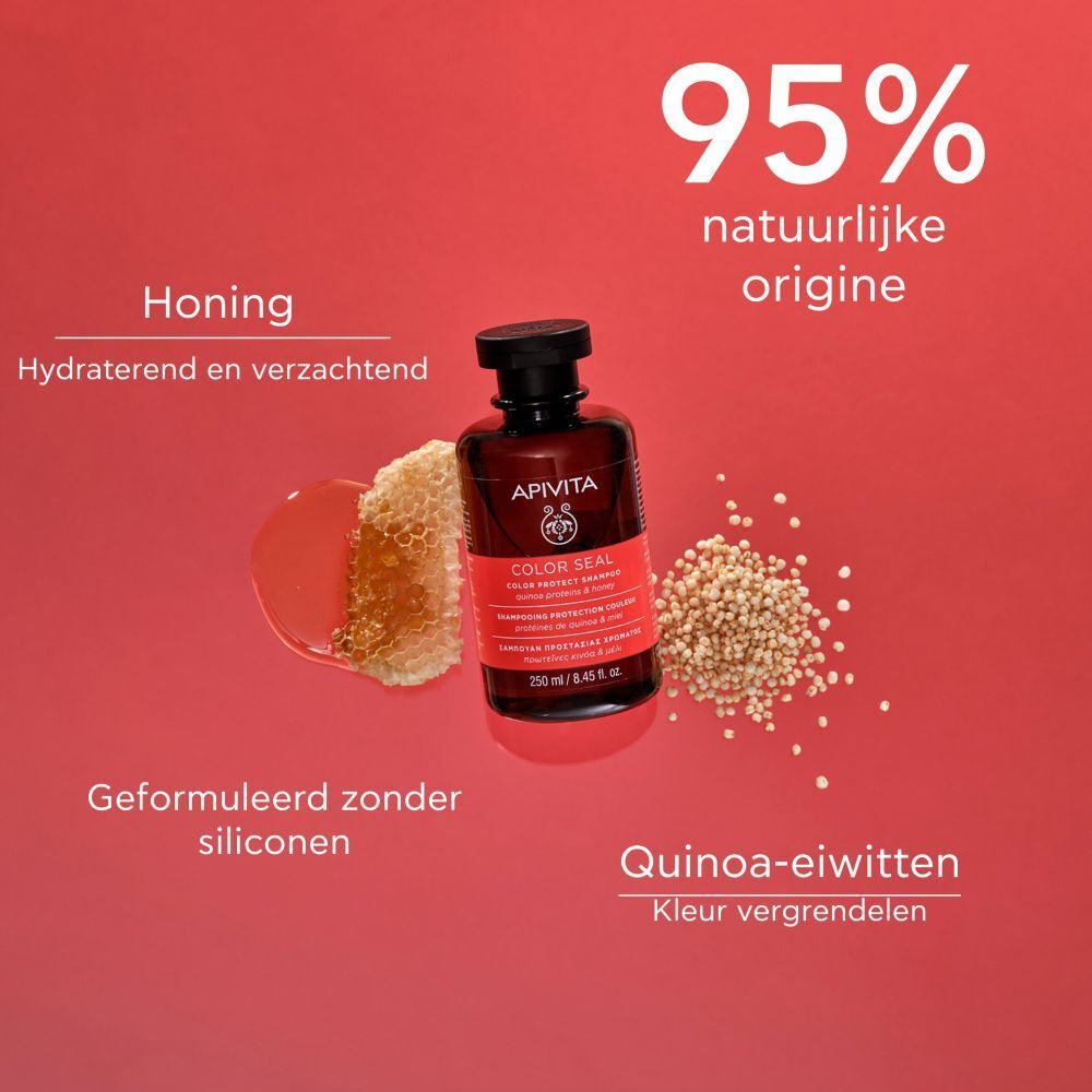 Bruine fles, zwarte dop. Rood etiket: COLOR SEAL, Shampoo. 250 ml. Met honing en quinoa.