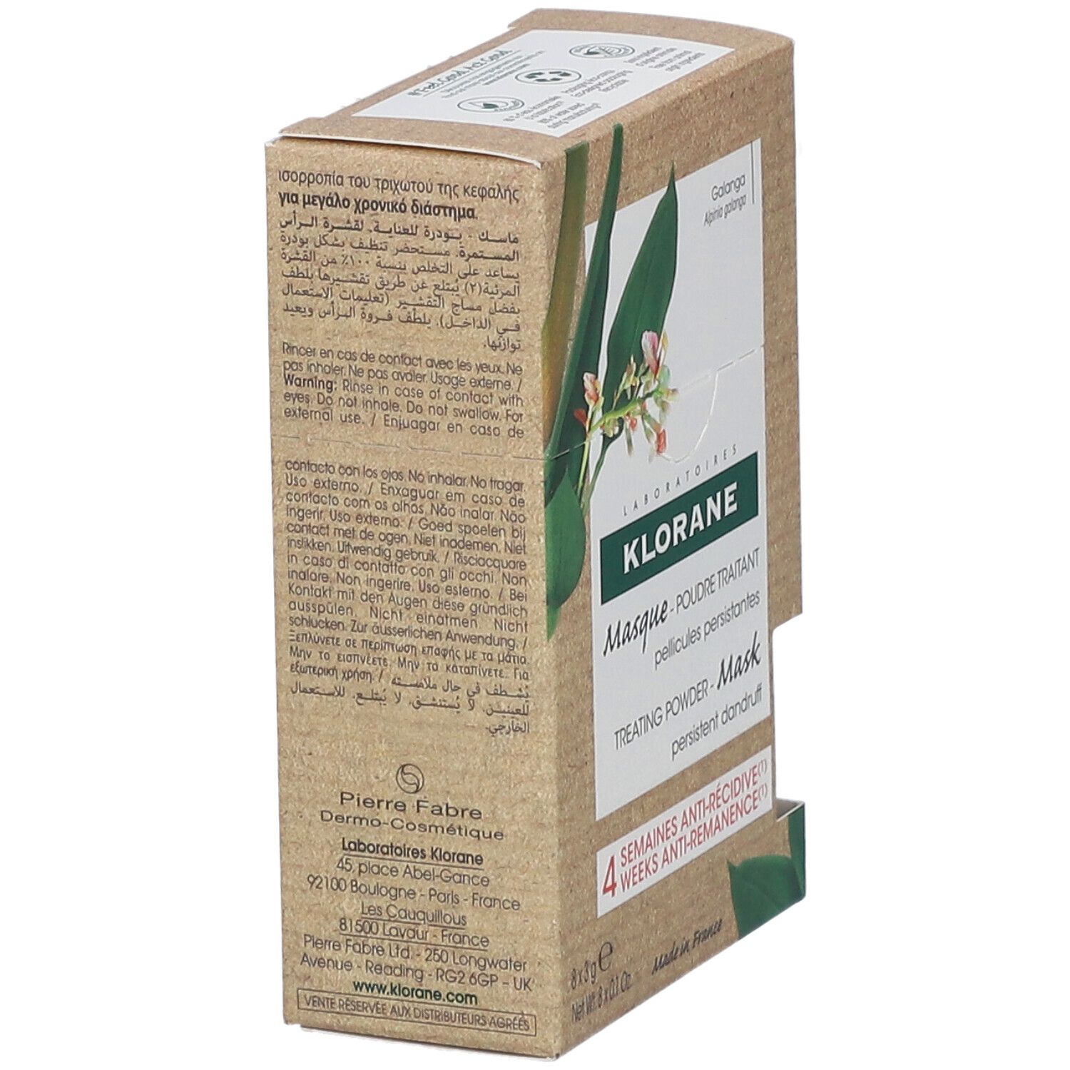 Klorane poedermasker doos. Bruine doos met productinfo. Opschrift: 4 weken anti-terugval. Zijkant met meertalige tekst.