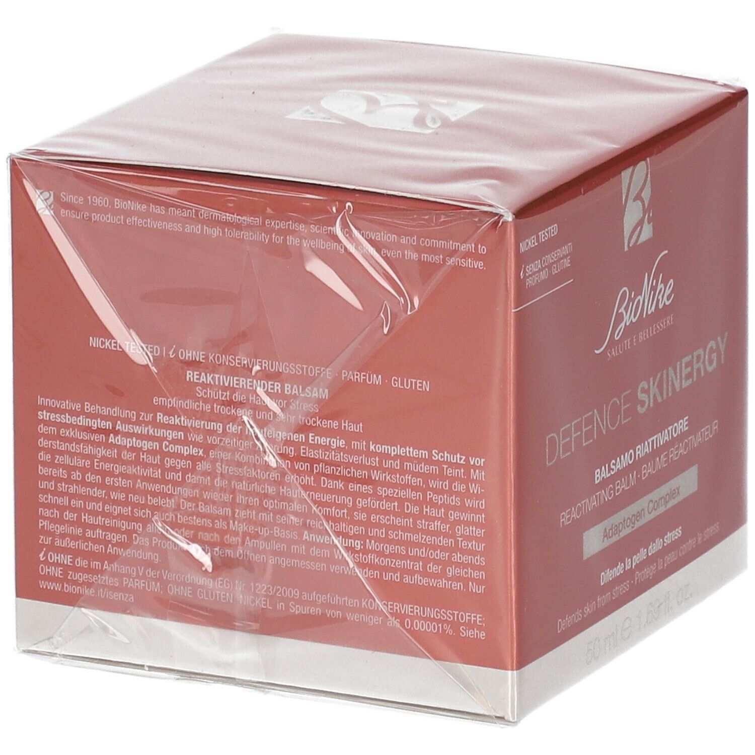 Rückseite der BioNike DEFENCE SKINERGY Balsam-Verpackung. Rote Schachtel mit Text. Nickel getestet.