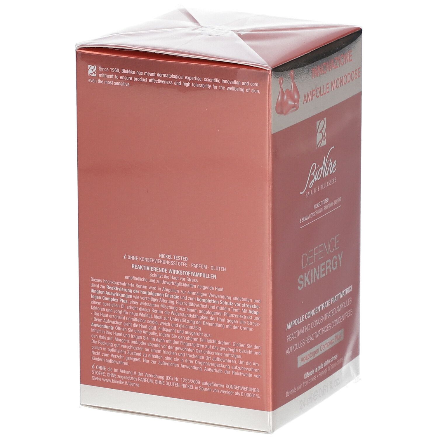 Boîte rose et blanche. Texte et logo. Texte: DEFENCE SKINERGY. Dos avec texte.