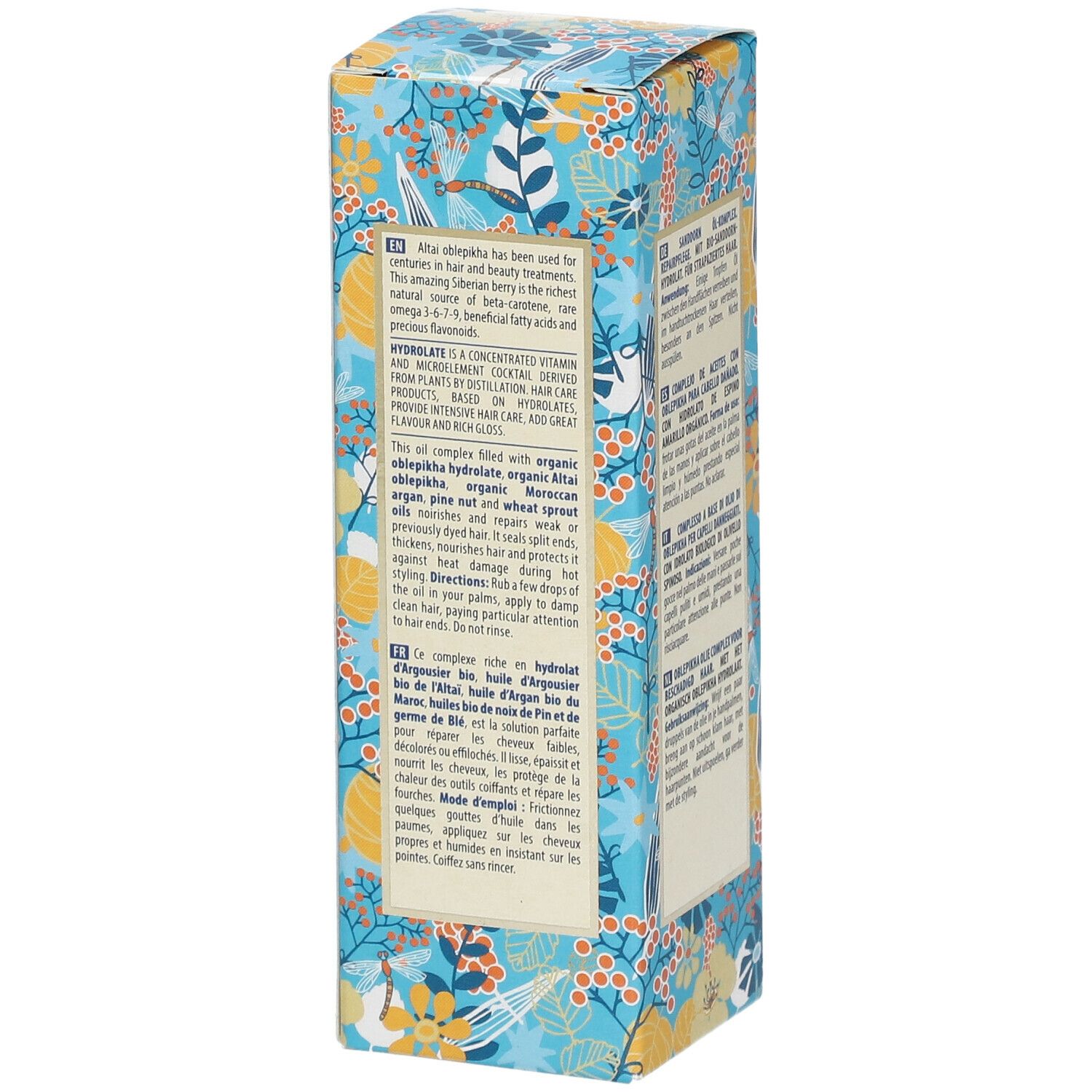 Seite der Kartonverpackung mit Text. Beschreibt Inhaltsstoffe und Anwendung. Floralmuster.