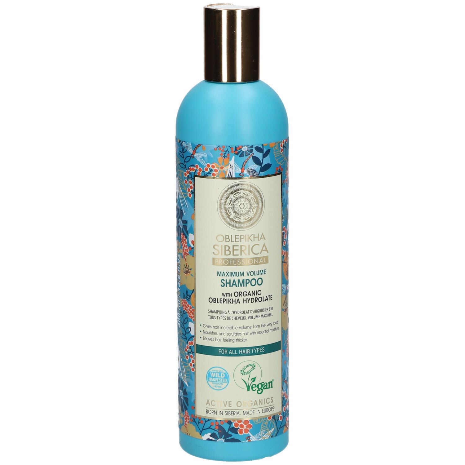Blauw-turkooizen shampoo fles met bloemenpatroon. Gouden dop. Tekst: Oblepikha Siberica, Maximum Volume Shampoo.