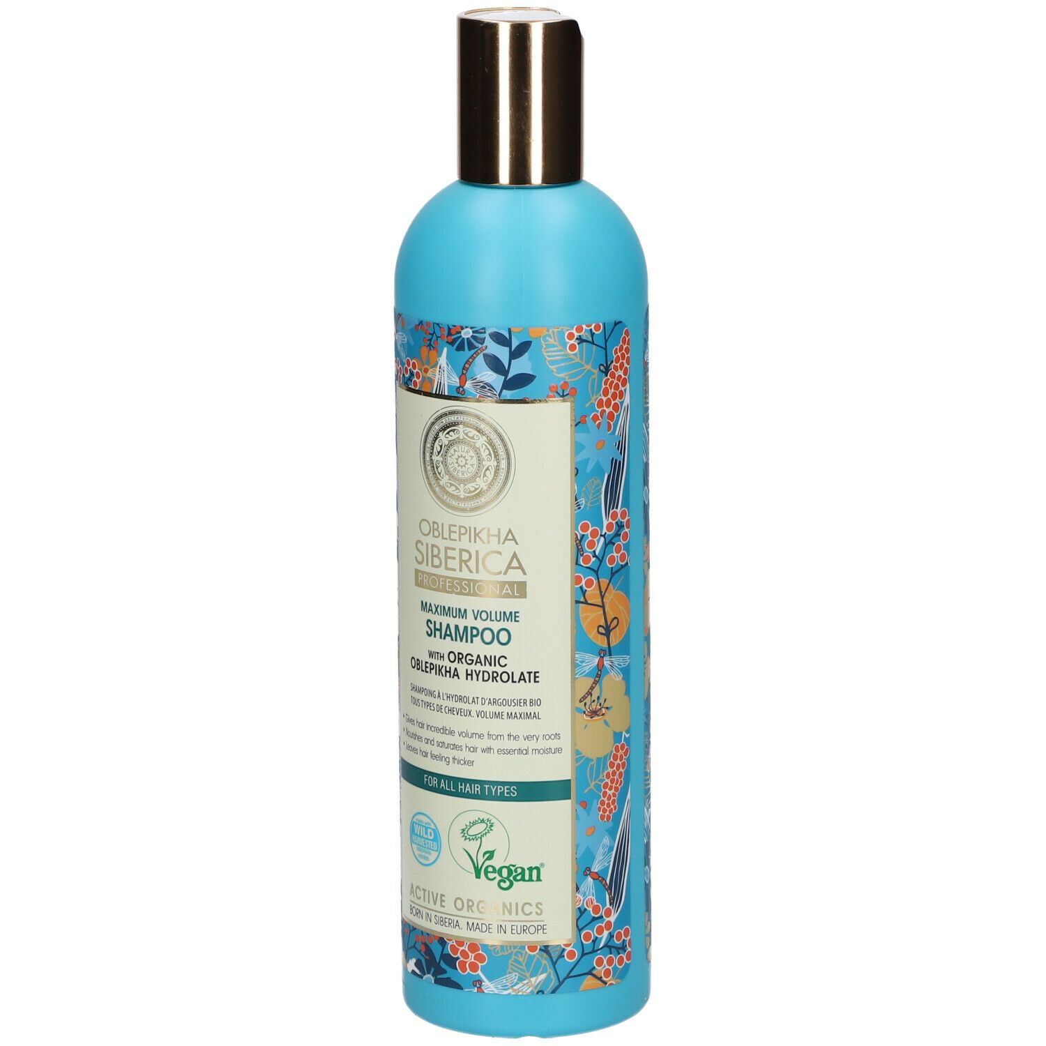 Blauw-turkooizen shampoo fles met bloemenpatroon. Gouden dop. Tekst: Oblepikha Siberica, Maximum Volume Shampoo.