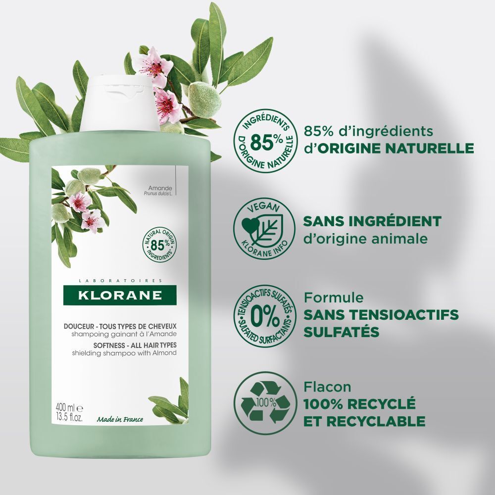 Flacon de shampooing KLORANE à l'amande. Vert, bouchon blanc. Étiquette avec texte, illustration et logo.