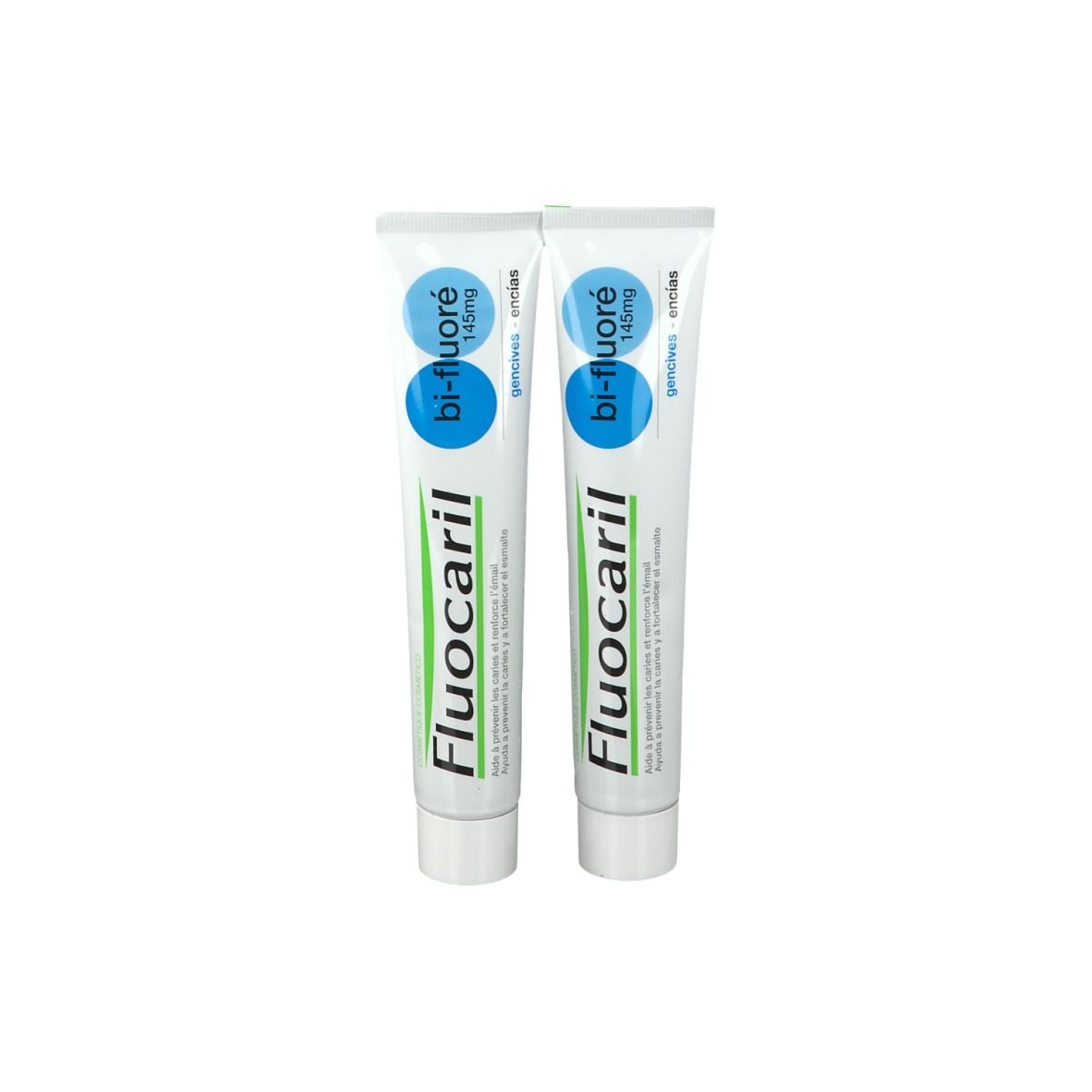 Deux tubes de dentifrice Fluocaril bi-fluoré 145mg. Tubes blancs avec inscriptions bleues et vertes.
