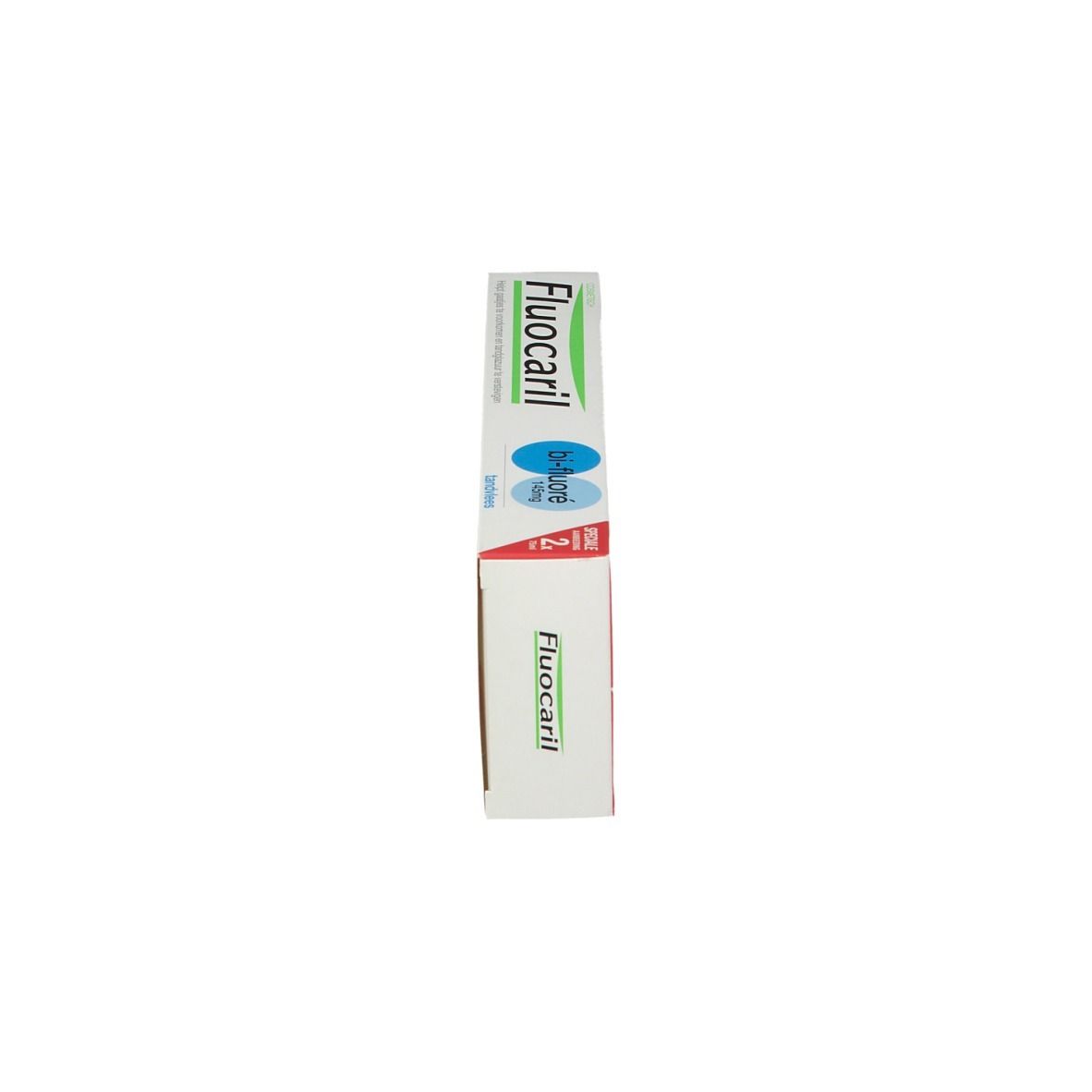 Emballage de dentifrice, vue latérale. Emballage avec inscriptions bleues et vertes. Inscription: Fluocaril.