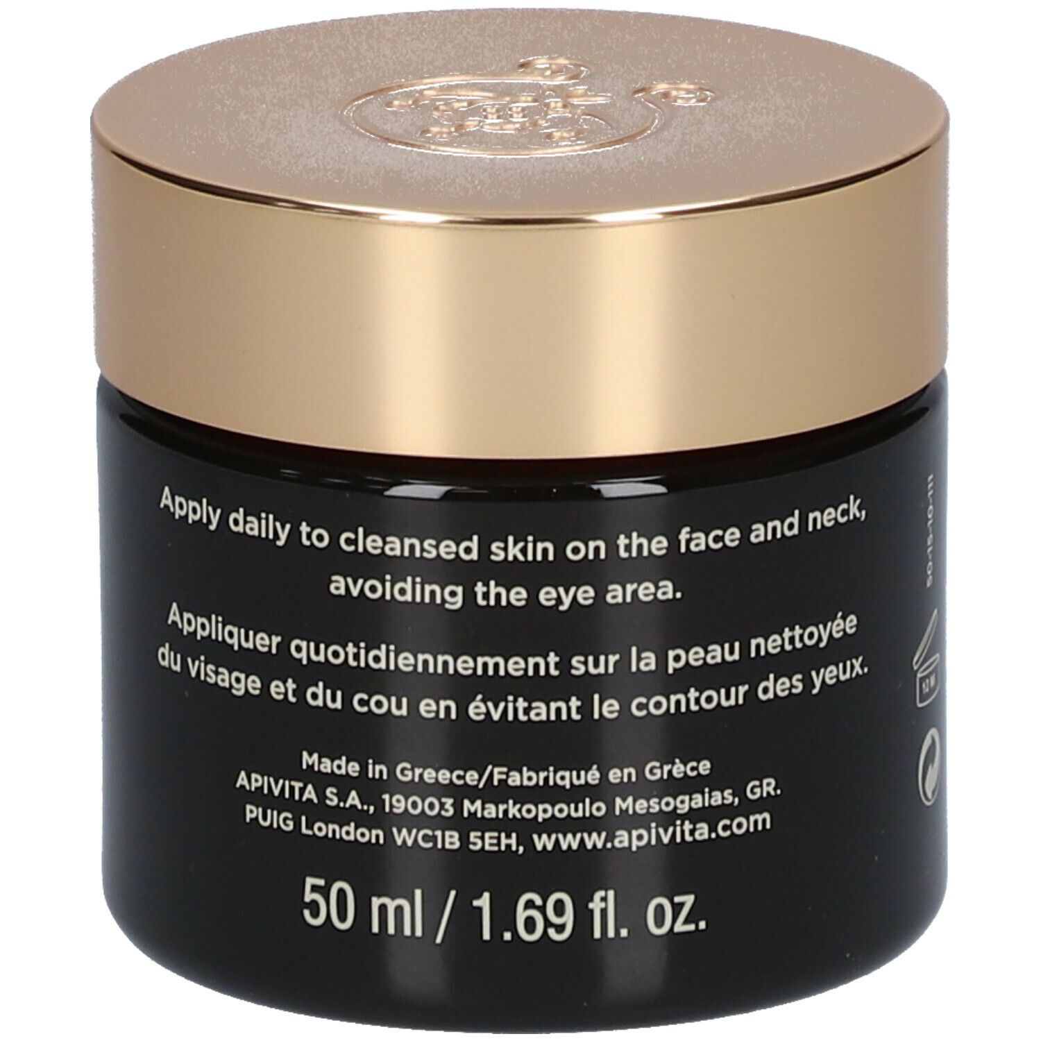 Donkere crème pot met gouden deksel. Opschrift: APIVITA Queen Bee Absolute Anti-Aging Creme Regenerierend - Lichte textuur. Tekst.