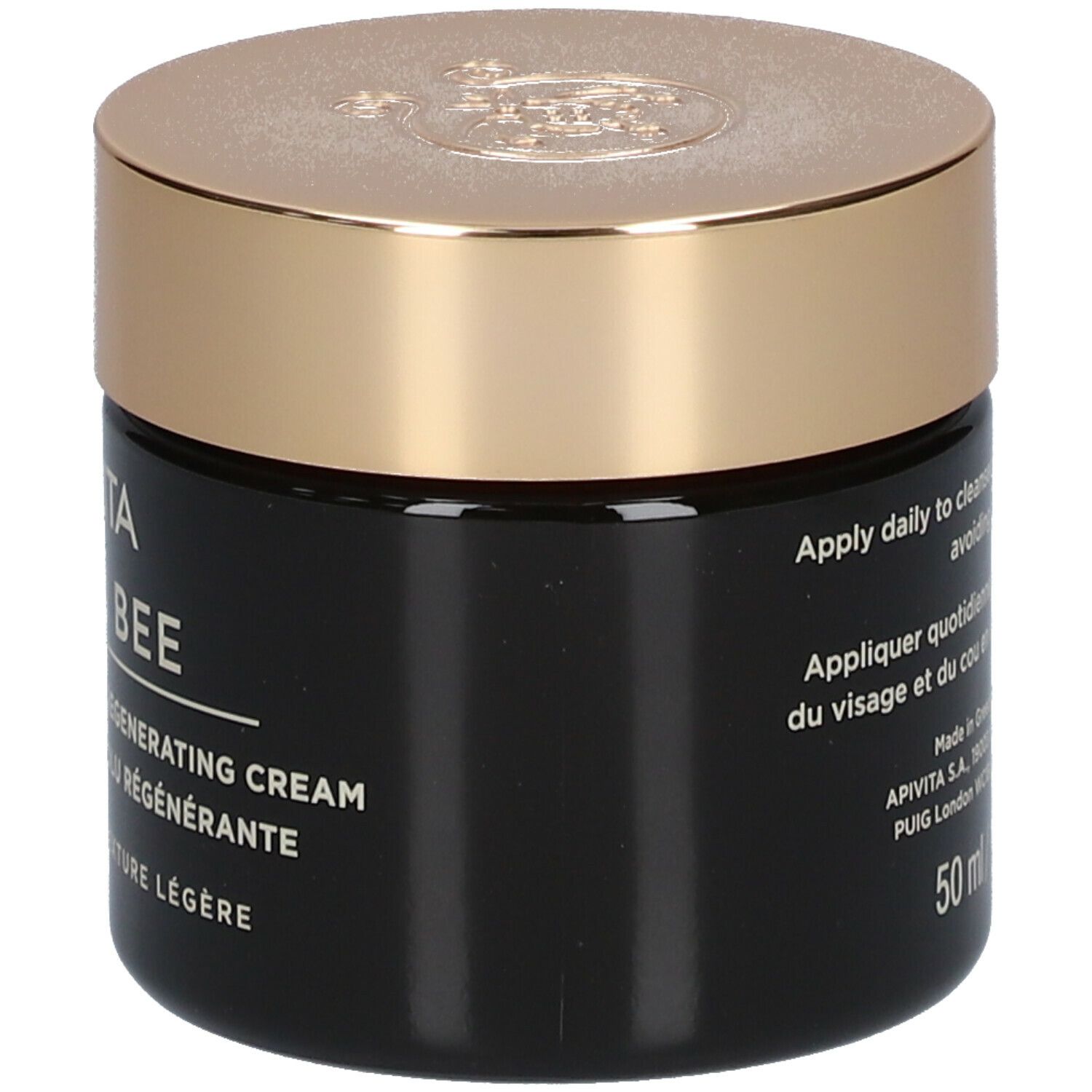 Donkere crème pot met gouden deksel. Opschrift: APIVITA Queen Bee Absolute Anti-Aging Creme Regenerierend - Lichte textuur. Zijkant.