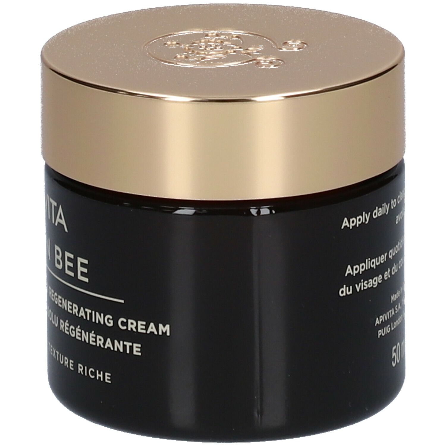 Dunkle Creme-Dose mit goldenem Deckel. Aufschrift: APIVITA QUEEN BEE Absolute Anti-Aging Creme.