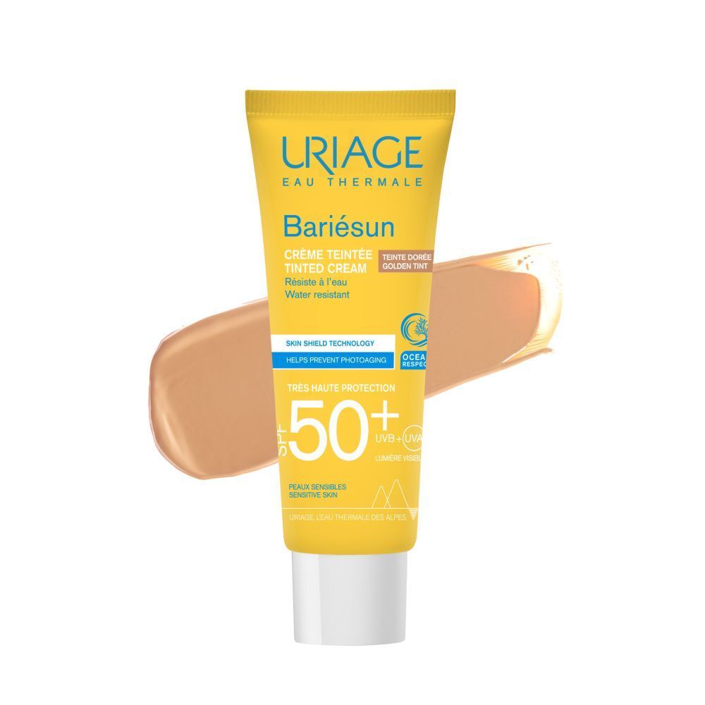 Uriage Bariésun getinte crème SPF50+ tube en productvoorbeeld. Gouden getinte crème.