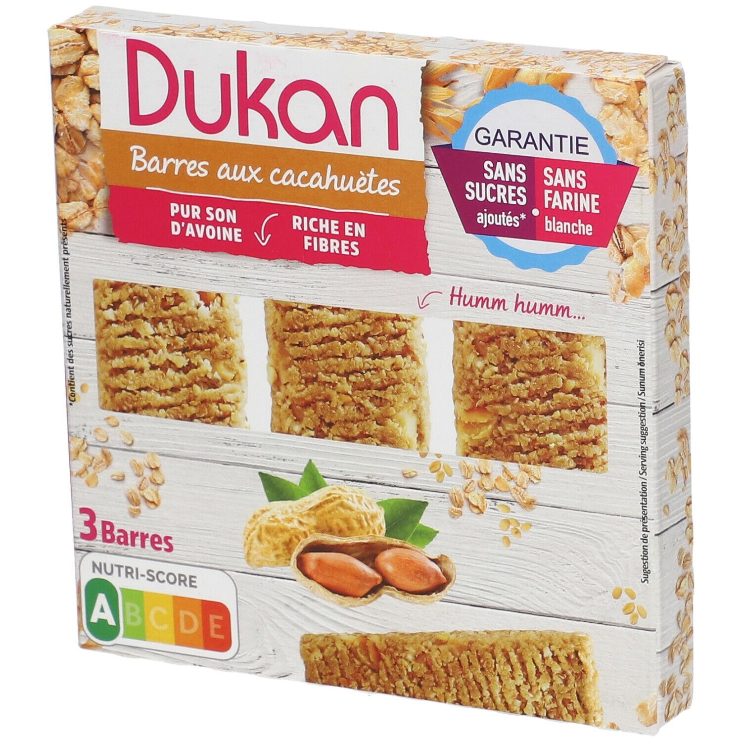 Dukan pinda reep verpakking. 3 repen, pinda's, havervlokken. Opschrift: Zonder toegevoegde suikers, zonder witte bloem. Voedingswaardetabel.