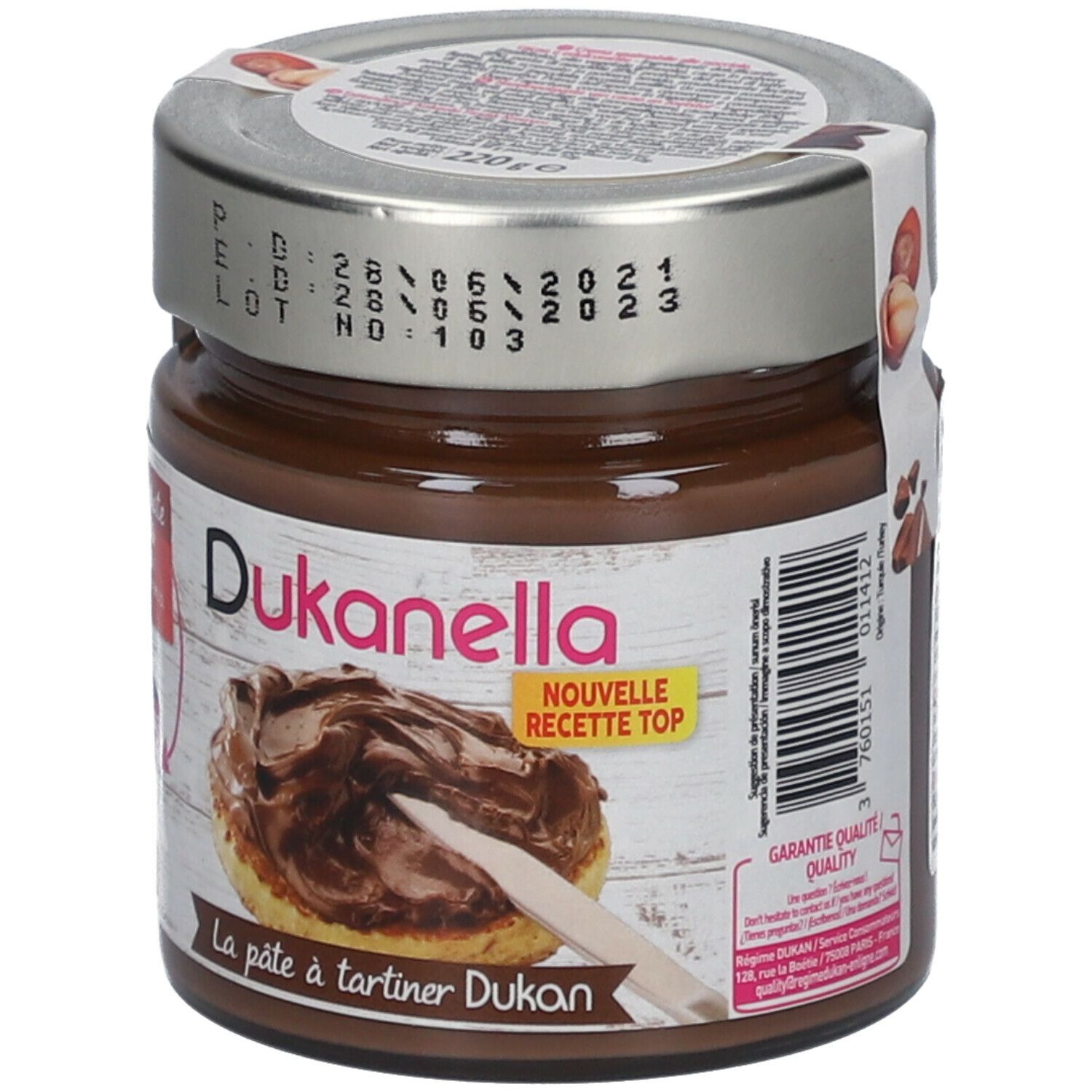 Pot chocoladecrème. Deksel met datums. Opschrift: Dukanella, Nouvelle Recette Top. Sticker met productafbeelding.