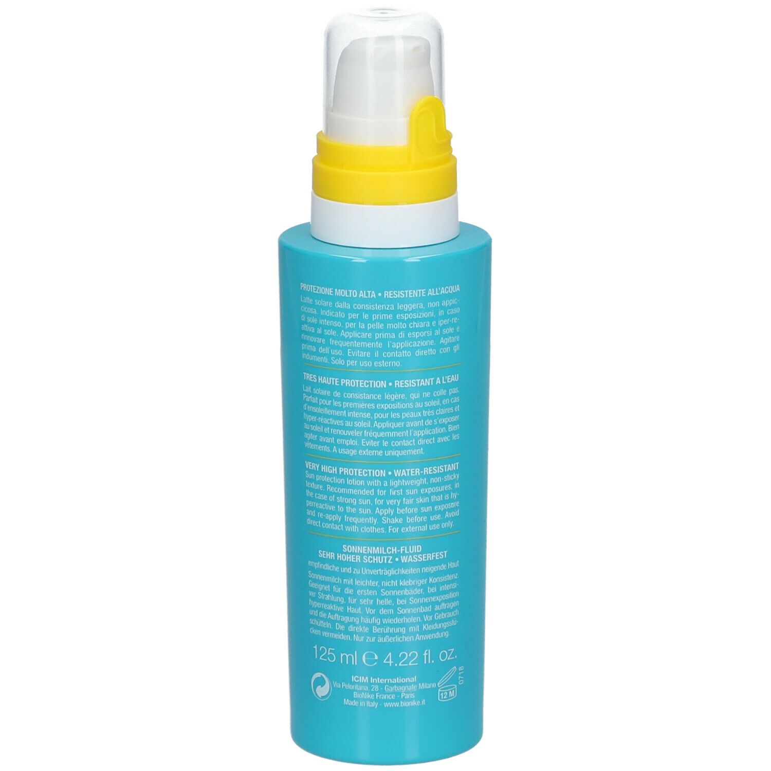 Dos du flacon turquoise avec pompe blanche. Anneau jaune. Texte.