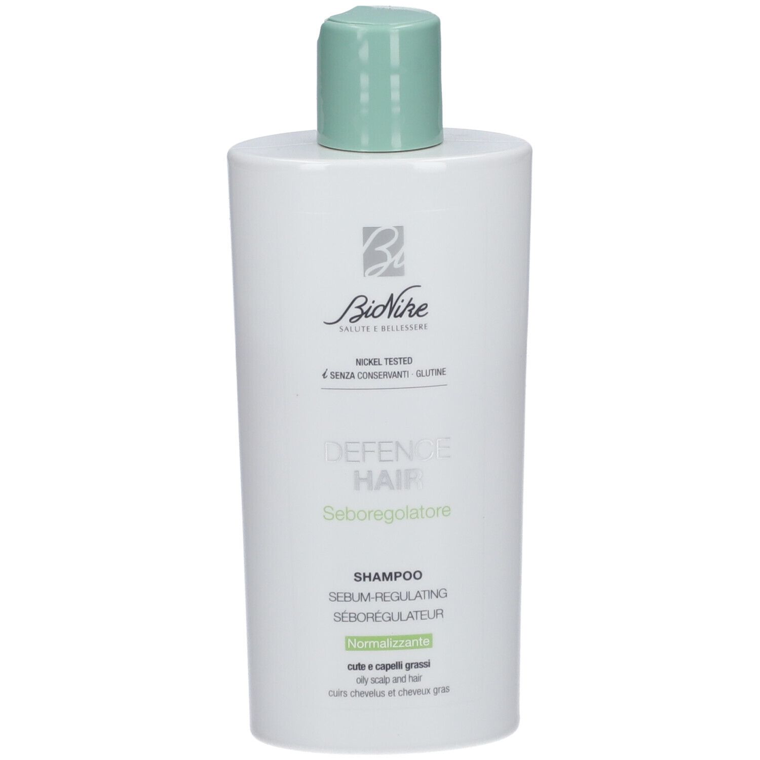 Flacon blanc avec bouchon vert. Inscription: BioNike, Defence Hair, Shampooing, Séborégulateur. Pour cuir chevelu gras.