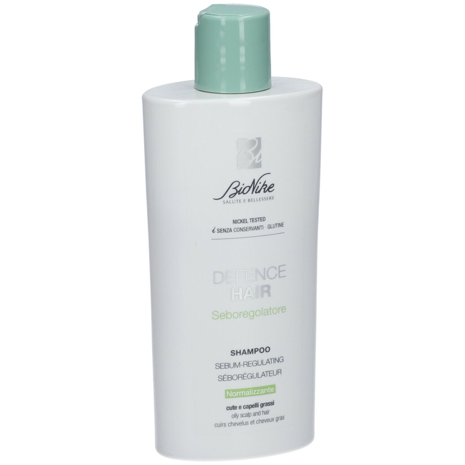 Flacon blanc avec bouchon vert. Inscription: BioNike, Defence Hair, Shampooing, Séborégulateur. Pour cuir chevelu gras.