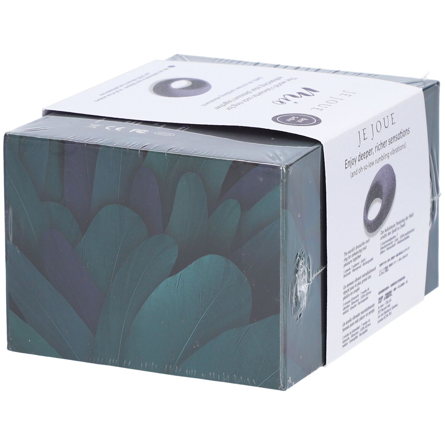 Emballage Je Joue Mio. Produit en forme d'anneau. Texte: Enjoy deeper, richer sensations. Emballage transparent.