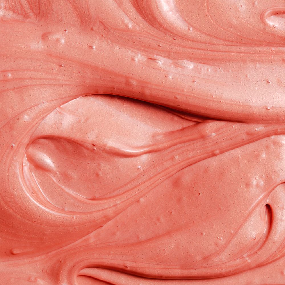 Close-up van crème. Roze textuur met wervelingen.