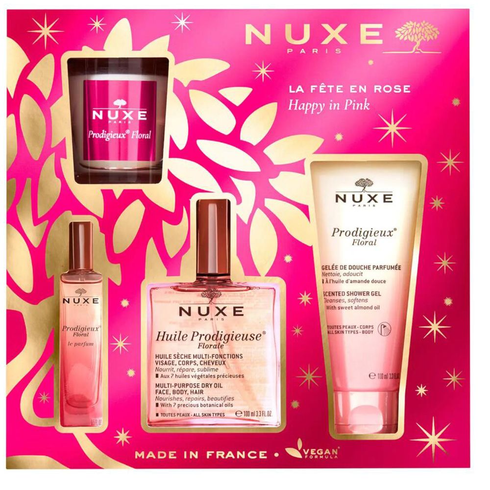 Nuxe cadeau set. Bevat olie, douchegel, parfum en kaars. Roze verpakking met gouden accenten.