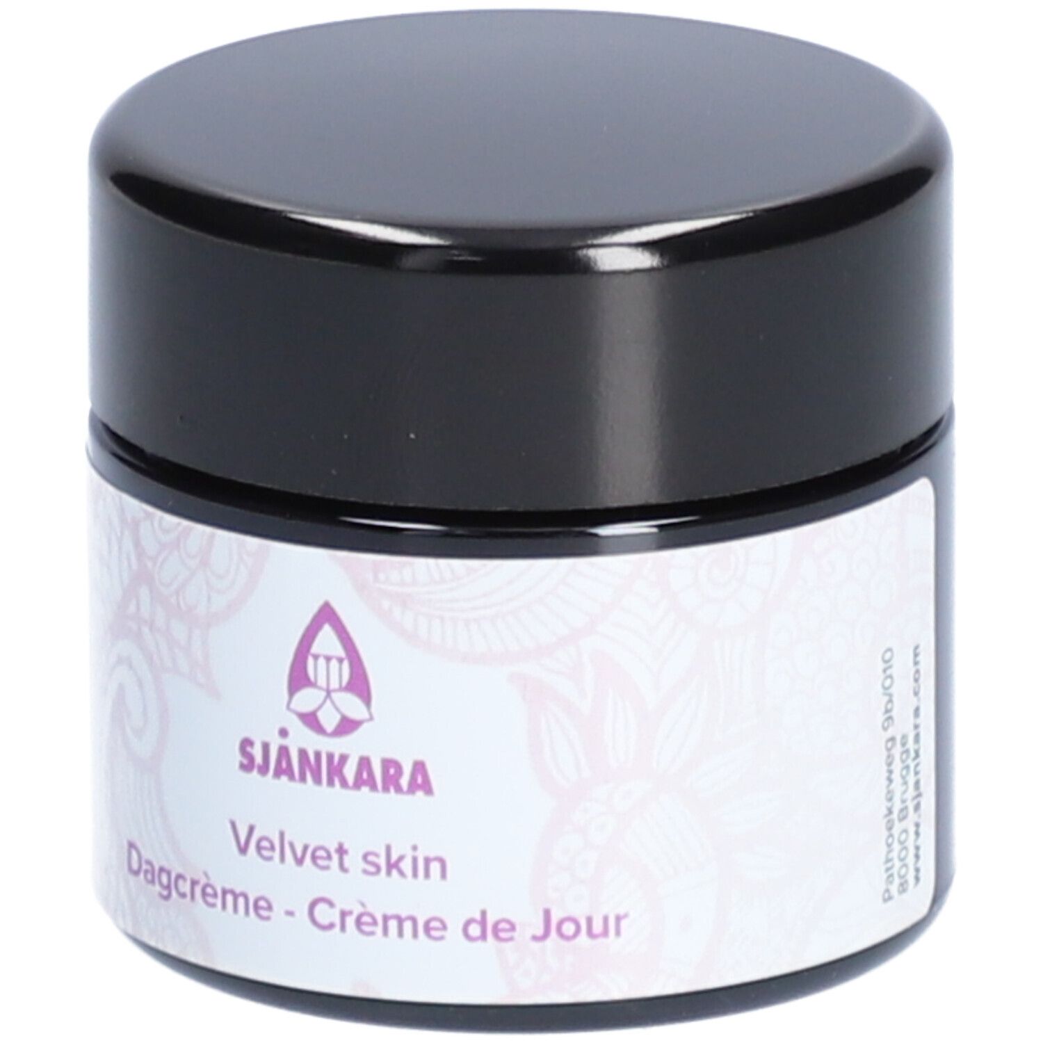 Pot de crème avec couvercle noir. Étiquette avec logo et texte: Velvet skin, Dagcrème - Crème de Jour.