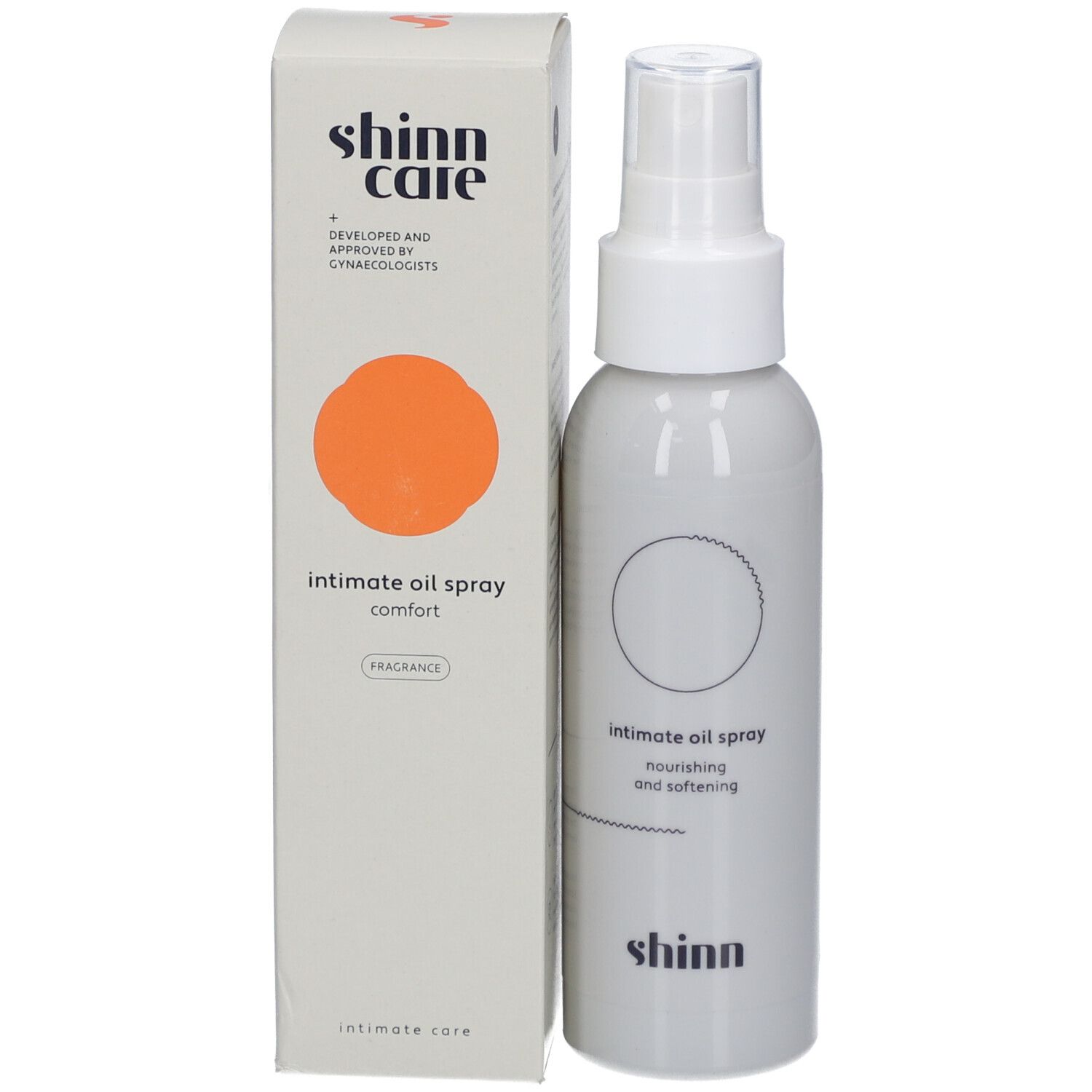 Weißes Spray und Schachtel. Aufschrift: intimate oil spray comfort. Marke: shinn care. Mit orangefarbenem Kreis.