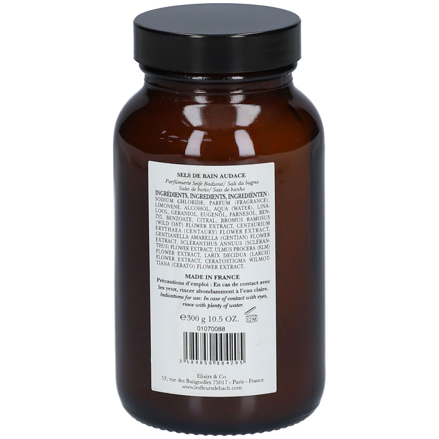 Bruine glazen fles met zwarte dop. Achterkant met tekst: ingrediënten, gebruiksaanwijzing, barcode.