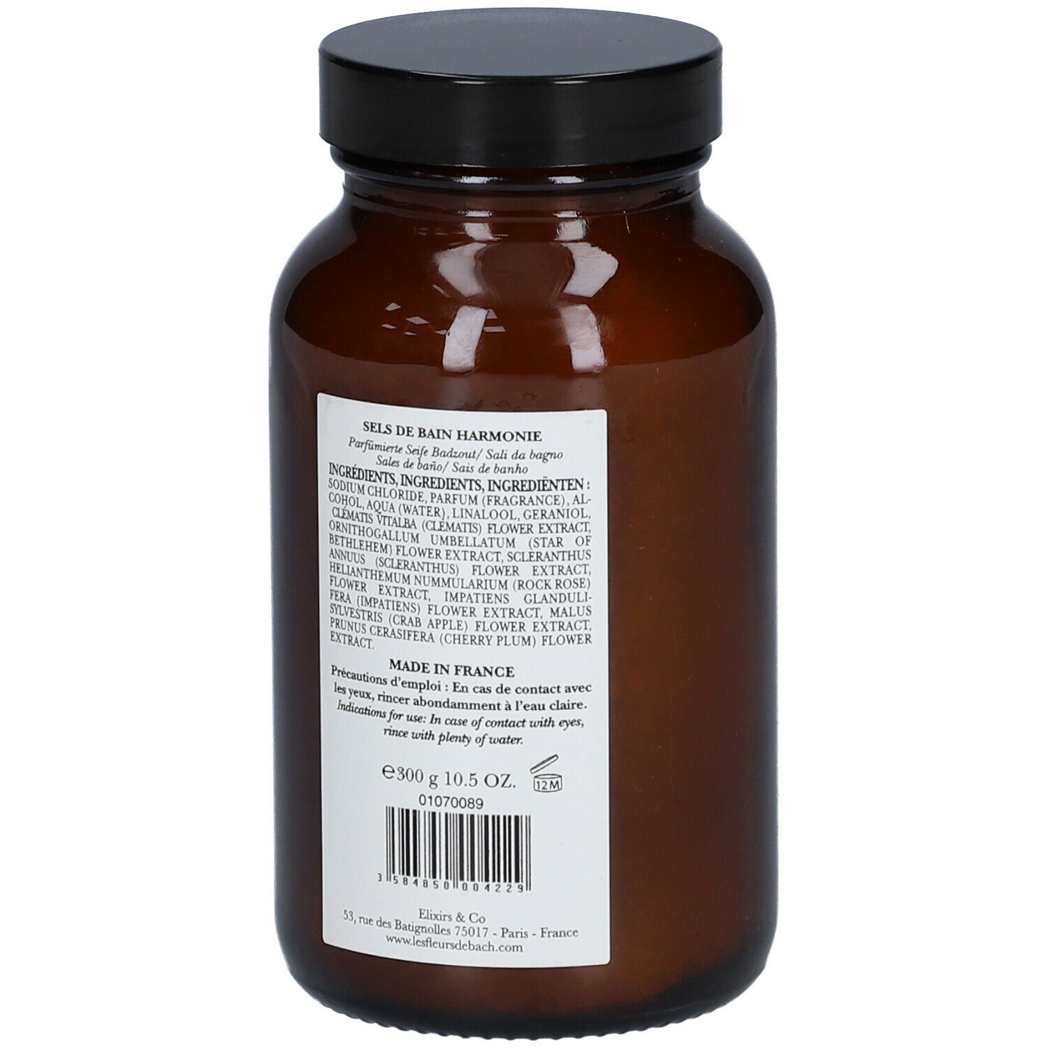 Bruine glazen fles met zwarte dop. Achterkant met tekst: Ingrediënten, gebruiksaanwijzing, fabrikantinfo.