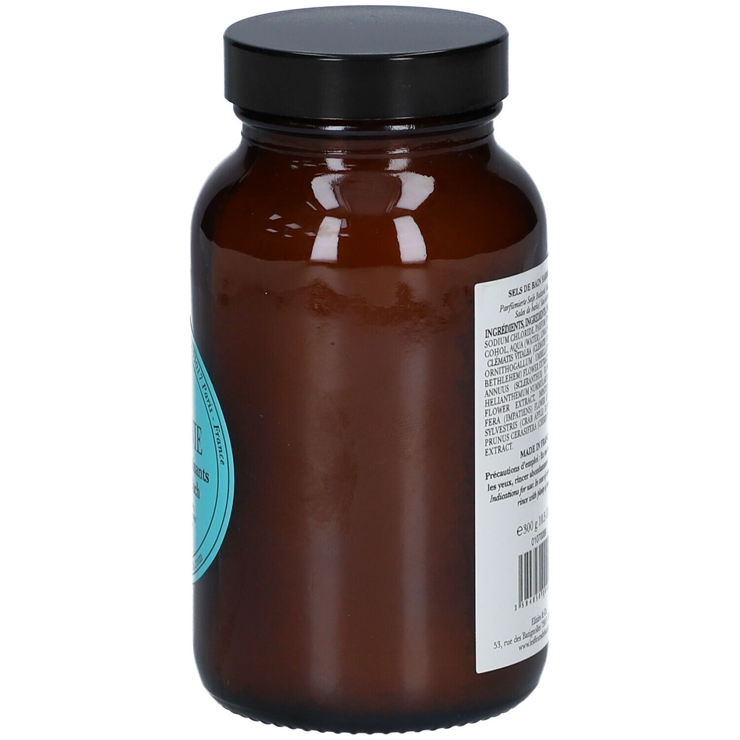 Bruine glazen fles met zwarte dop. Achterkant met tekst: Ingrediënten, gebruiksaanwijzing, fabrikantinfo.