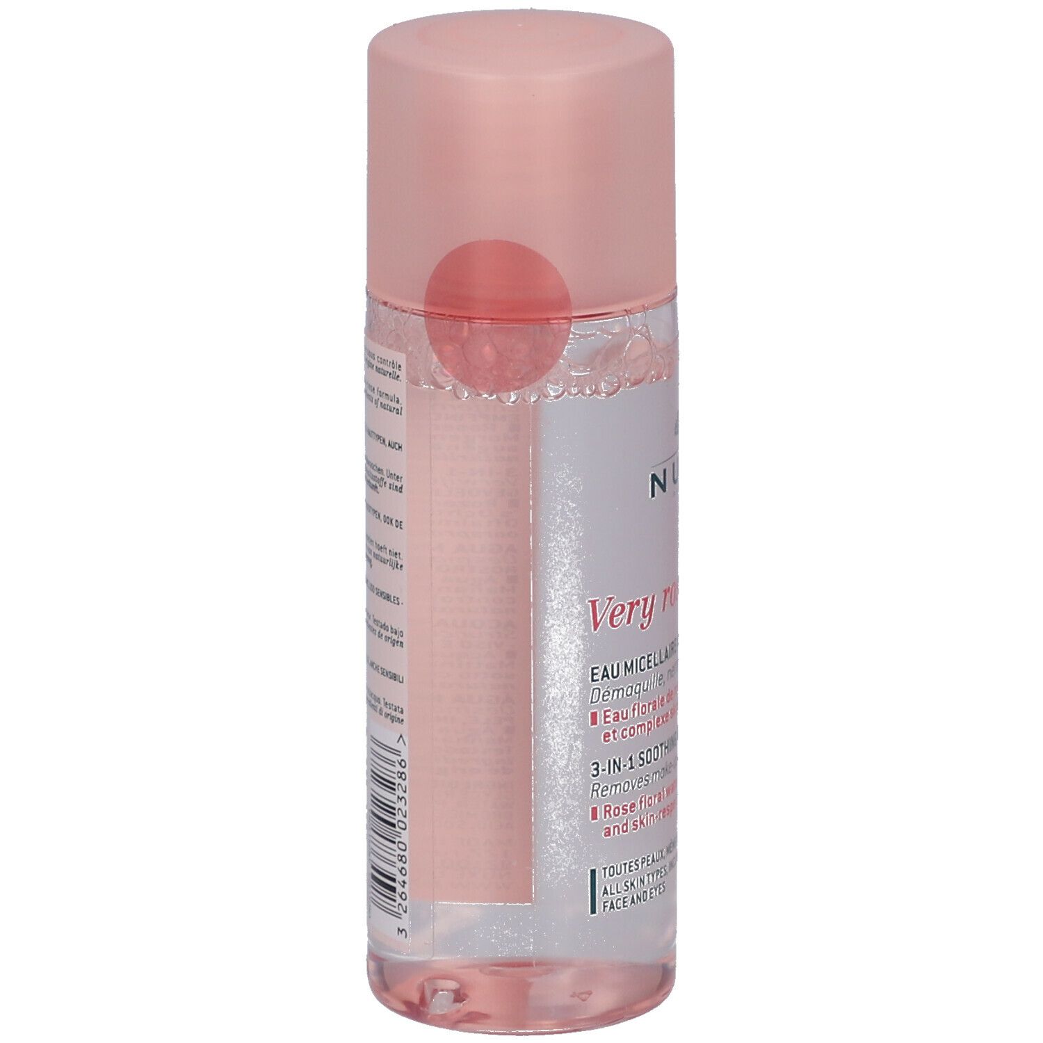 Flacon cylindrique rose avec bouchon rose. Liquide rose visible. Étiquette avec texte. Vue arrière.