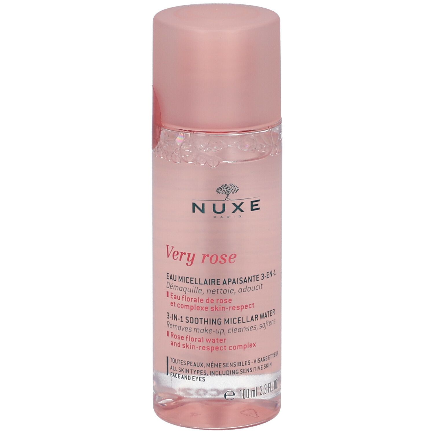 Flacon cylindrique avec liquide rose et bouchon rose. Inscription : Nuxe, Very rose. Vue de face.