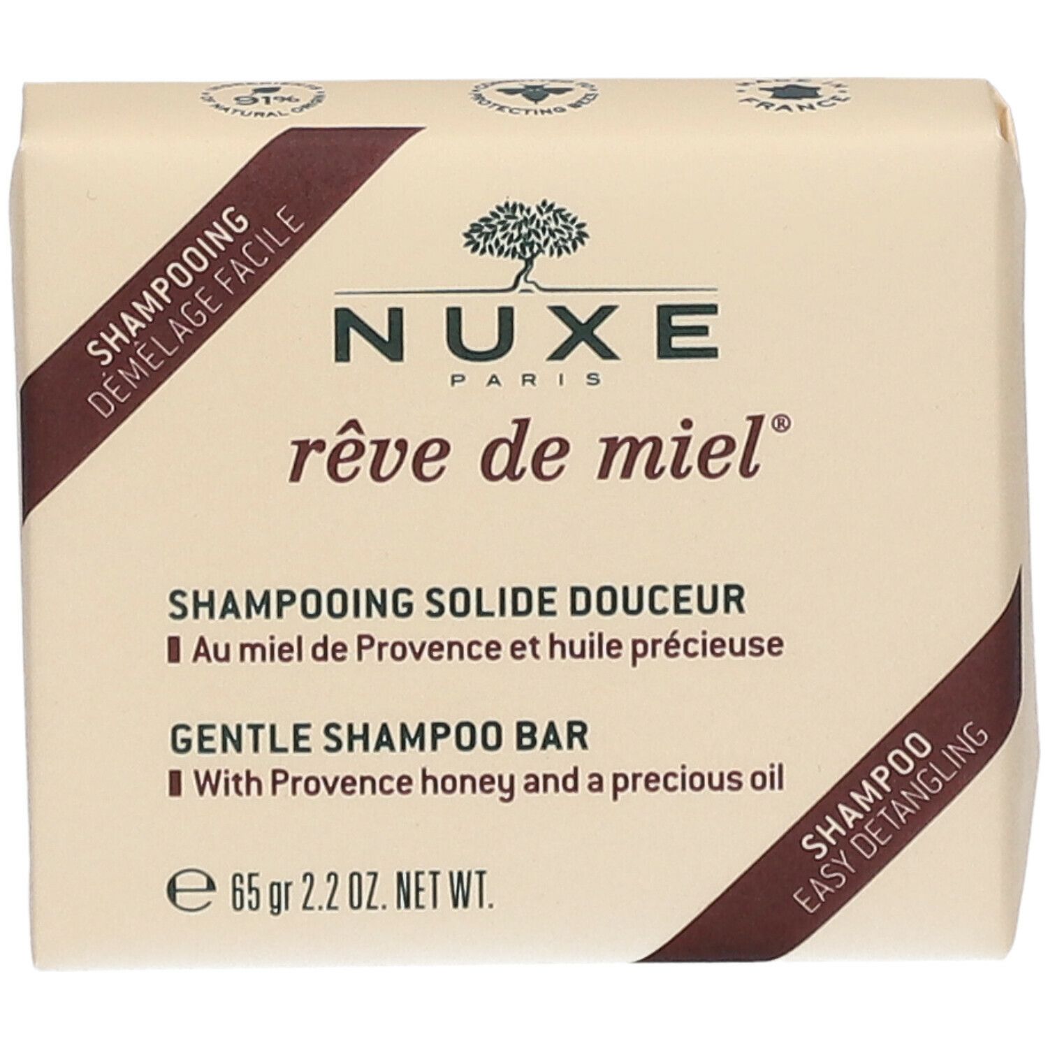 Verpakte shampoo. Opschrift: Nuxe Paris, rêve de miel. Shampooing Solide Douceur. Met honing en olie. 65 g.