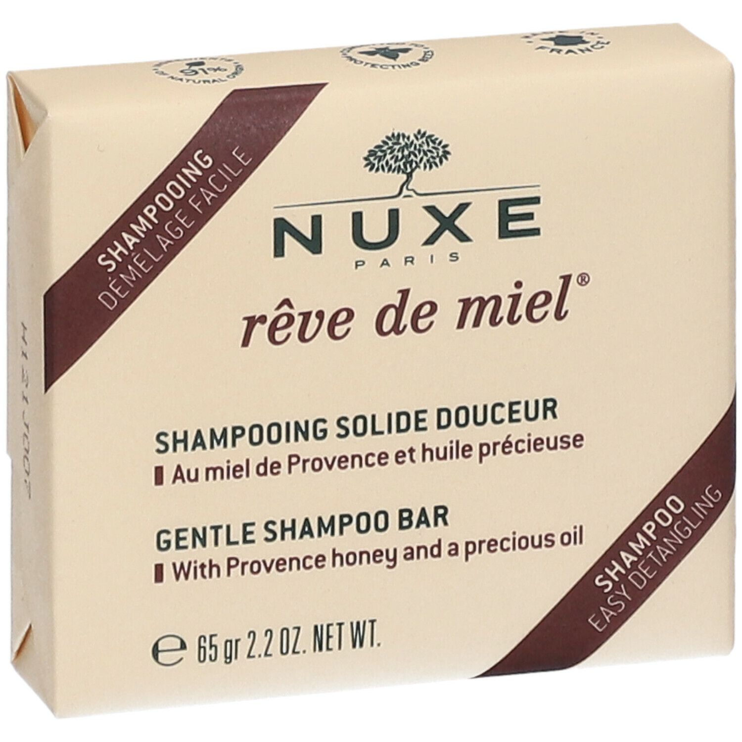 Verpakte shampoo. Opschrift: Nuxe Paris, rêve de miel. Shampooing Solide Douceur. Met honing en olie. 65 g.