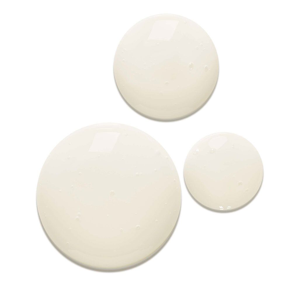 Drie druppels shampoo. Lichtgeel. Op witte achtergrond.