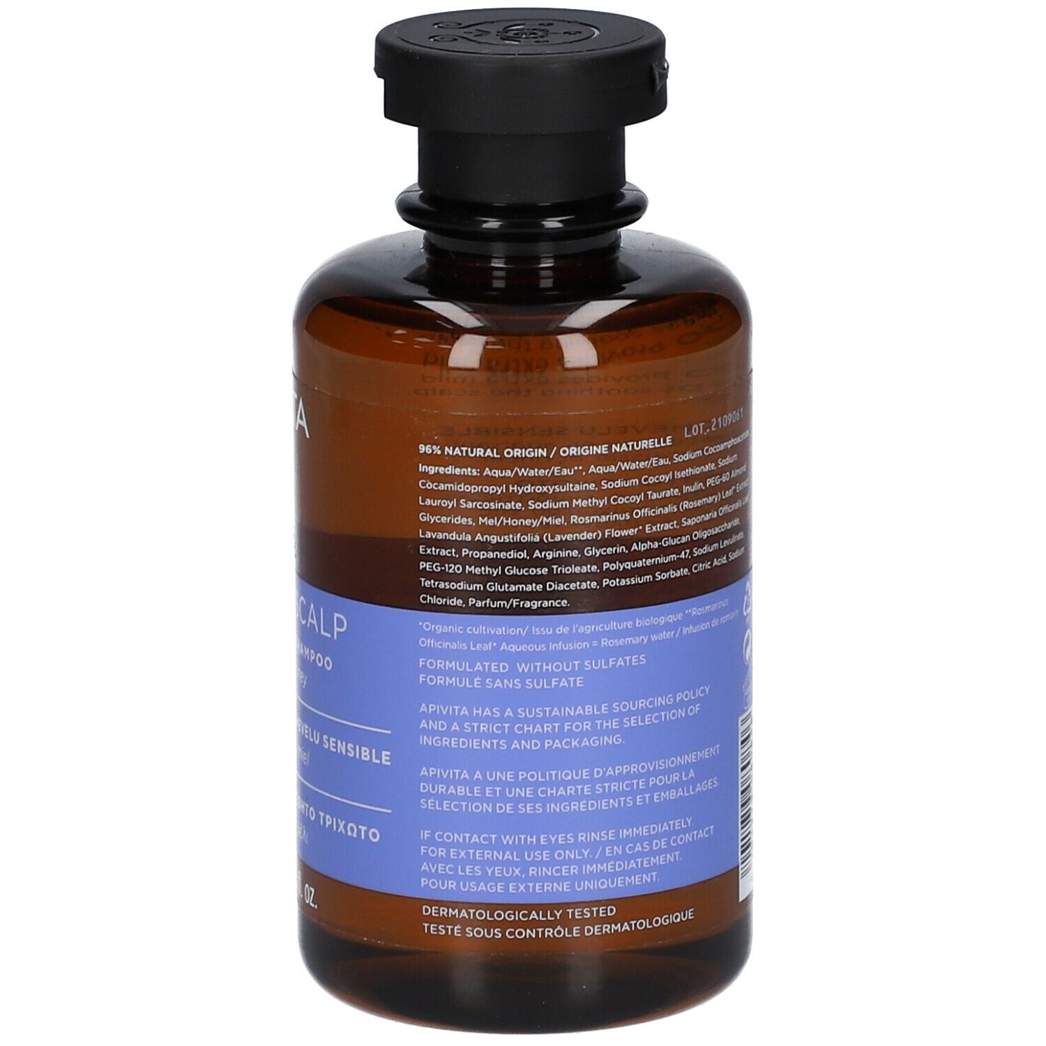 Rückseite der braunen Flasche mit schwarzem Deckel. Text auf blauem Etikett.