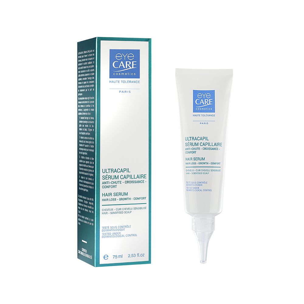 Weißes Serum mit Applikator und Verpackung. Aufschrift: Eye Care, Ultracapil Sérum Capillaire, Hair Serum.