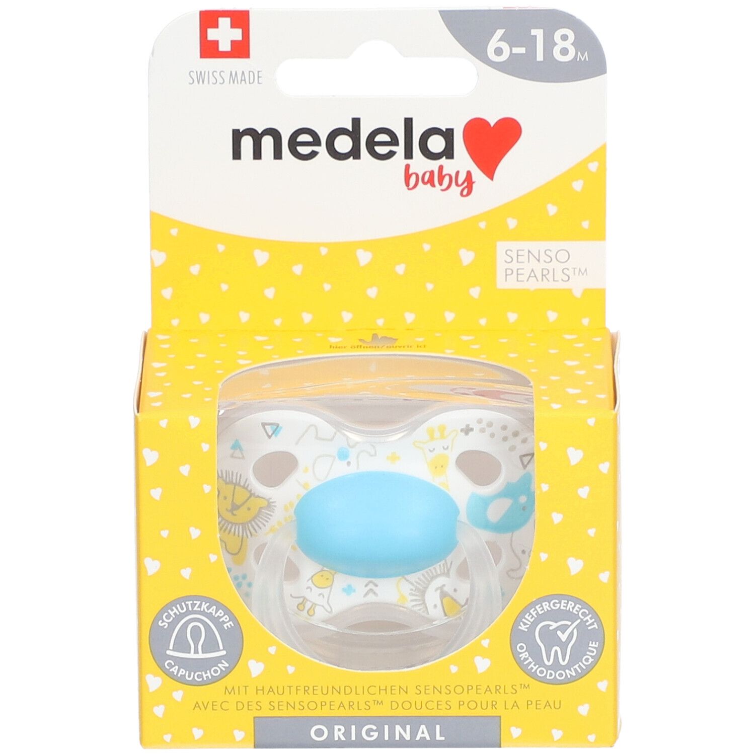Sucette Medela Baby dans emballage. Turquoise, 6-18 mois. Fenêtre transparente. Boîte jaune à motifs cœurs.