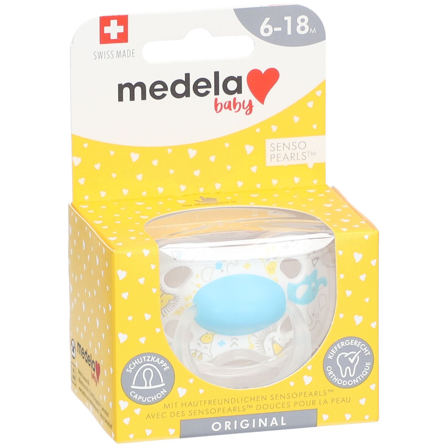 Sucette Medela Baby dans emballage. Turquoise, 6-18 mois. Fenêtre transparente. Boîte jaune à motifs cœurs.