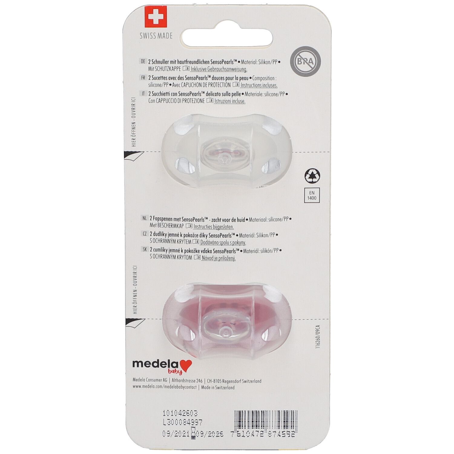 Rückseite der Verpackung mit zwei Schnullern. Text in mehreren Sprachen, darunter Deutsch, Französisch, Italienisch und Niederländisch.