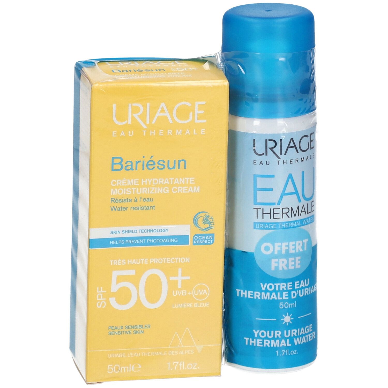 Gelbe Schachtel und blaue Sprühflasche. Auf der Schachtel steht "URIAGE Bariésun". Auf der Flasche steht "EAU THERMALE".