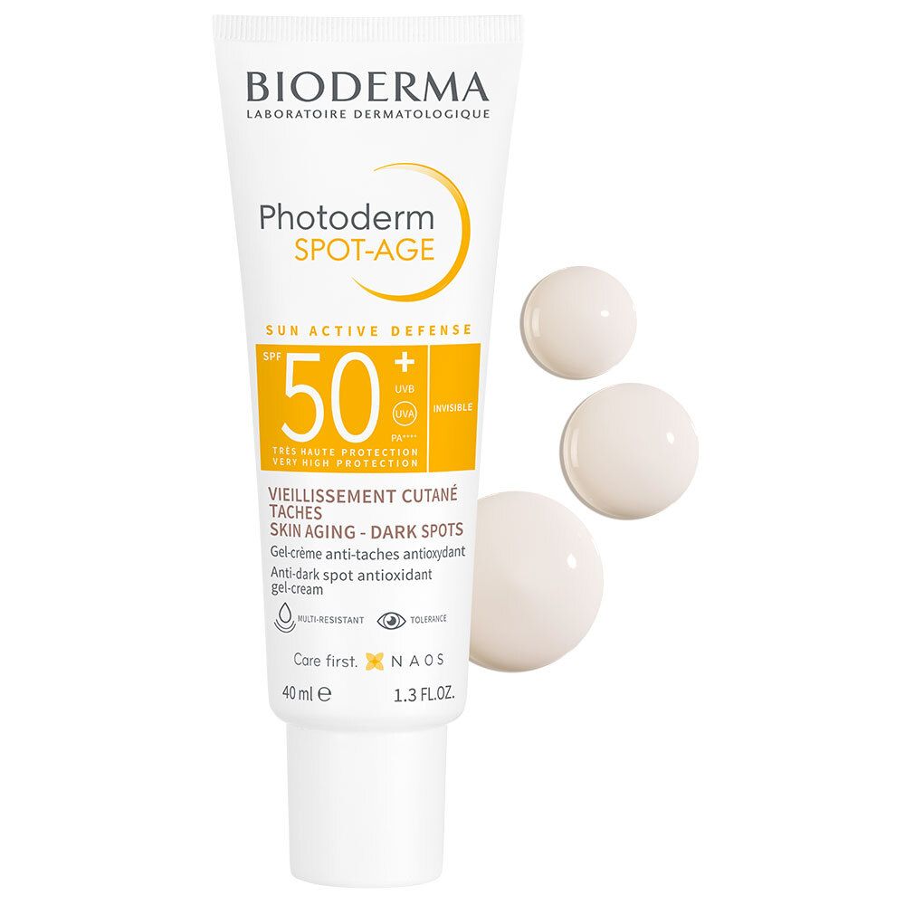 BIODERMA Photoderm Spot-Age SPF50+ tube en drie klodders gel-crème. Witte klodders op lichte achtergrond.