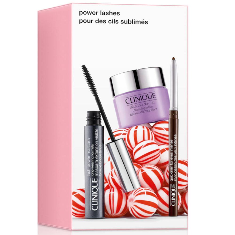 Geschenkset met mascara, make-up remover en eyeliner. Producten op rode en witte achtergrond. Roze verpakking.